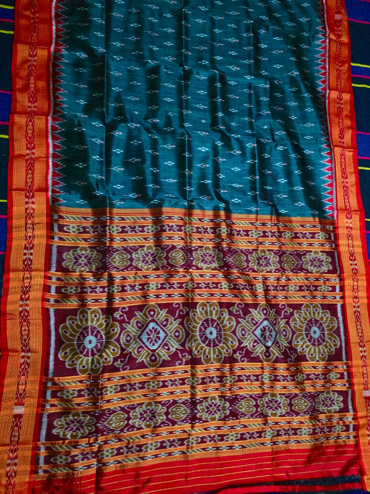 Model in premium Maroon and Black Sambalpuri Saree inside a palace